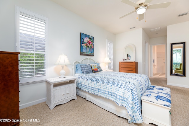 bedroom with baseboards, visible vents, a ceiling fan, and carpet floors