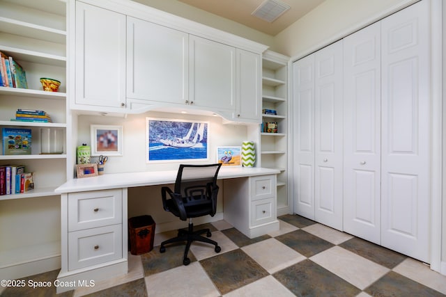 office area with built in study area and visible vents