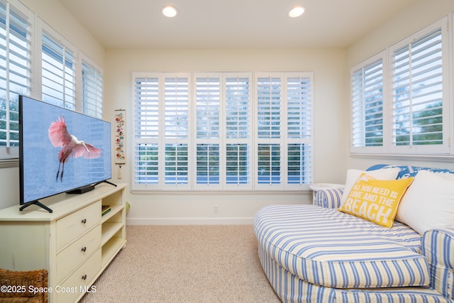 sitting room featuring baseboards, recessed lighting, and carpet
