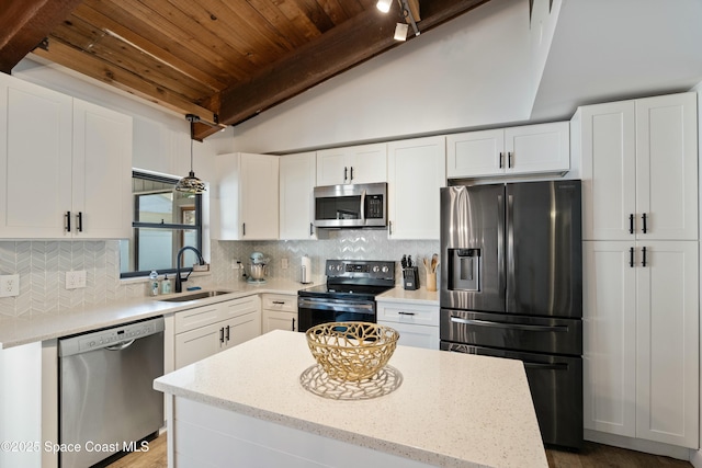 kitchen featuring a sink, decorative backsplash, stainless steel appliances, wooden ceiling, and white cabinetry