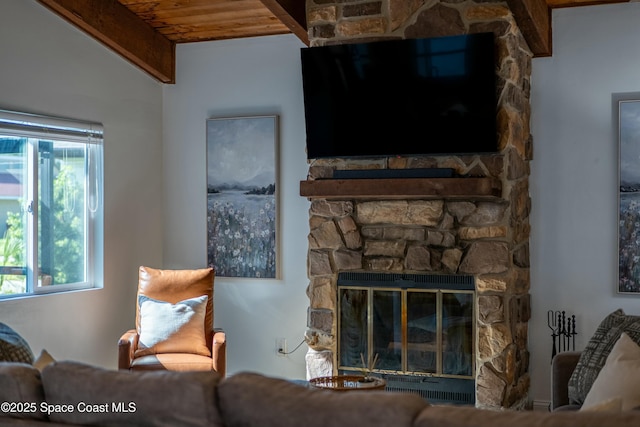 living room featuring wood ceiling and a fireplace