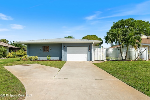 ranch-style house with fence, an attached garage, a front yard, and stucco siding