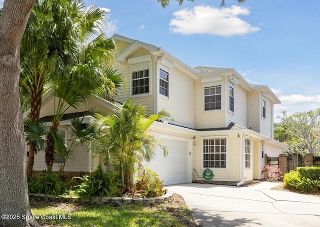 1609 Pga Blvd, Melbourne, FL 32935 - view of front of house featuring an attached garage, driveway, and fence
