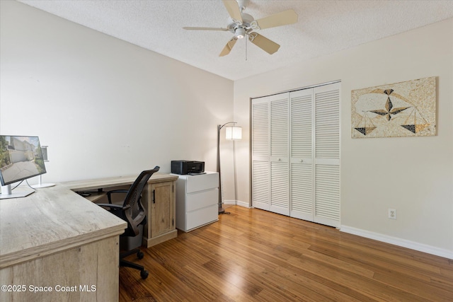 1609 Pga Blvd, Melbourne, FL 32935 - office area with wood finished floors, a textured ceiling, baseboards, and ceiling fan