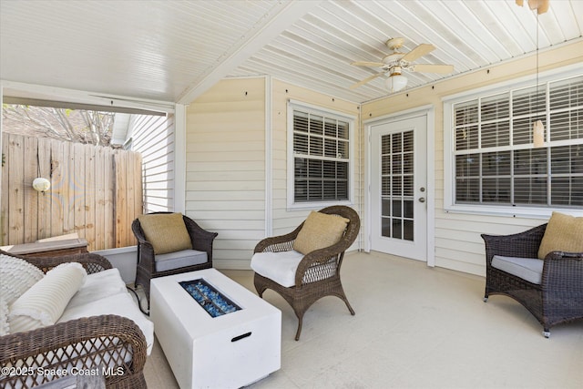1609 Pga Blvd, Melbourne, FL 32935 - view of patio with fence, an outdoor living space with a fire pit, and a ceiling fan