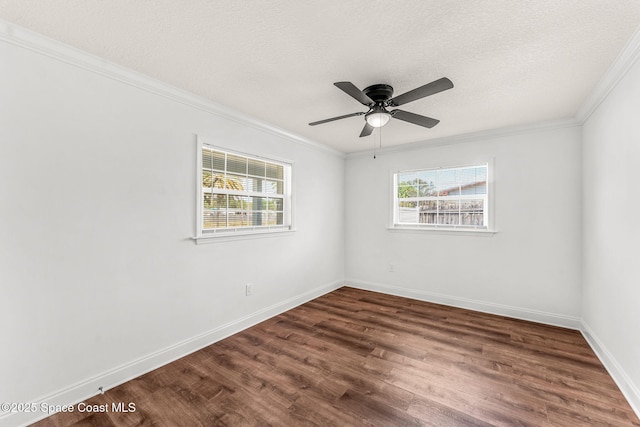 unfurnished room featuring baseboards, wood finished floors, a textured ceiling, and crown molding