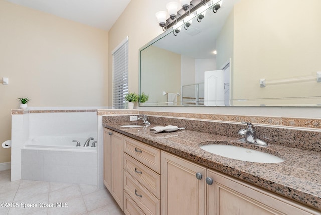 full bathroom featuring double vanity, tile patterned floors, a sink, and a garden tub