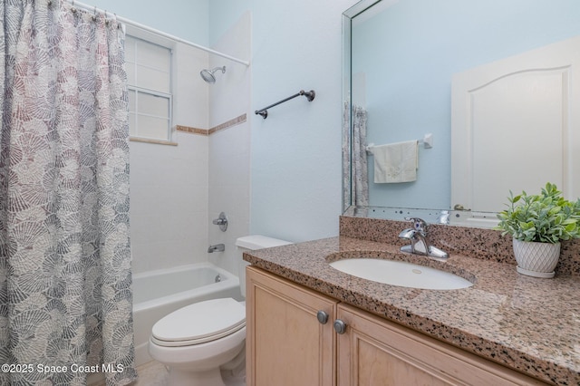 full bathroom with vanity, toilet, and shower / tub combo with curtain