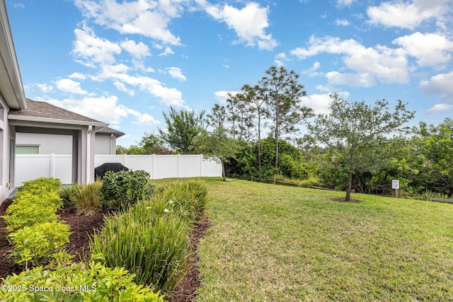 view of yard with fence