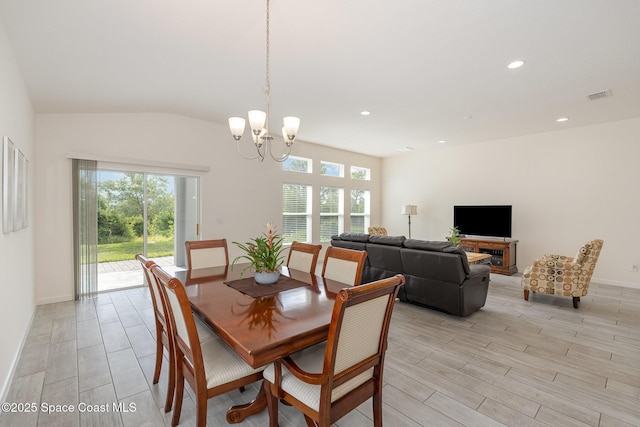 dining area with an inviting chandelier, a wealth of natural light, visible vents, and light wood-style floors