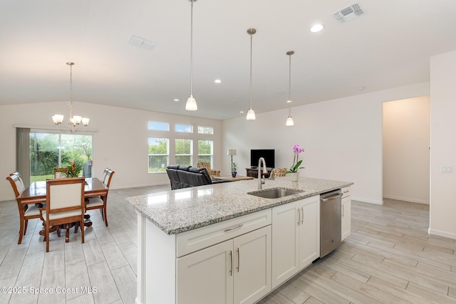kitchen featuring a chandelier, stainless steel dishwasher, visible vents, and a sink
