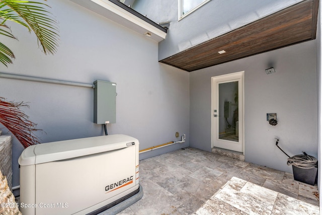 property entrance featuring stucco siding and a patio area