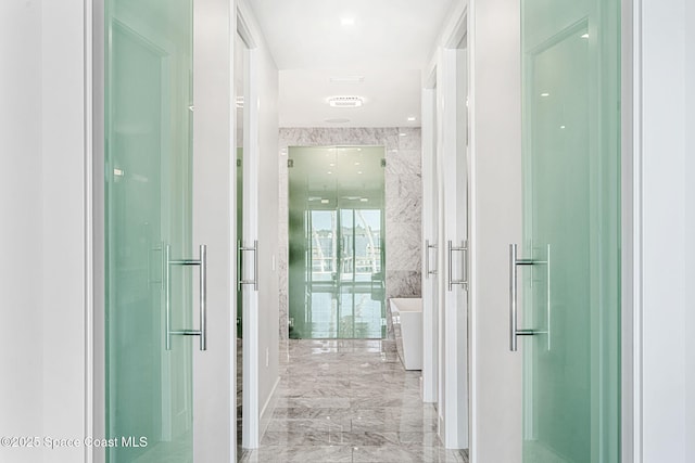 hallway featuring marble tiled flooring