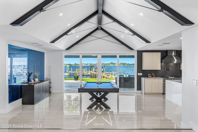 game room featuring baseboards, a water view, beam ceiling, recessed lighting, and high vaulted ceiling