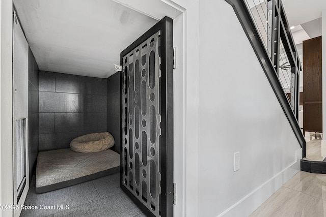 bathroom with tile patterned floors and baseboards