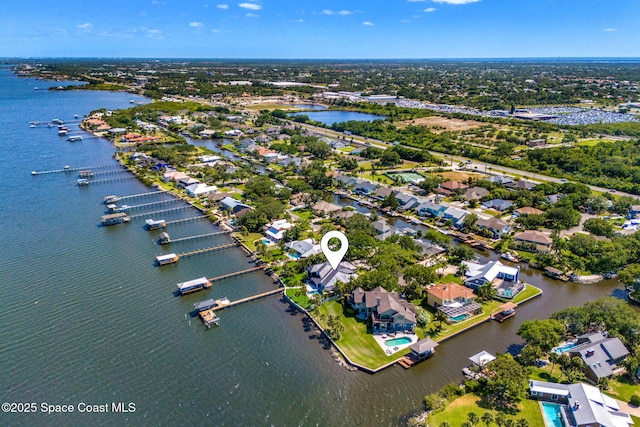 aerial perspective of suburban area with a large body of water
