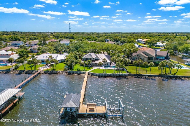 aerial view of residential area featuring a nearby body of water