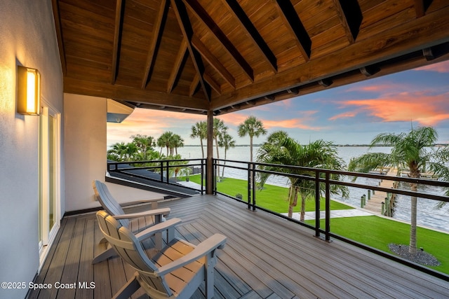 wooden deck with a water view