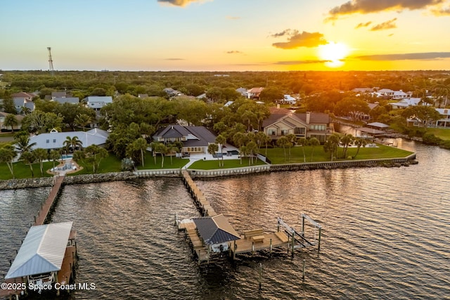 dock area featuring a water view and a residential view