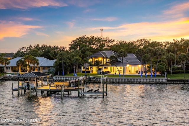 dock with boat lift and a water view