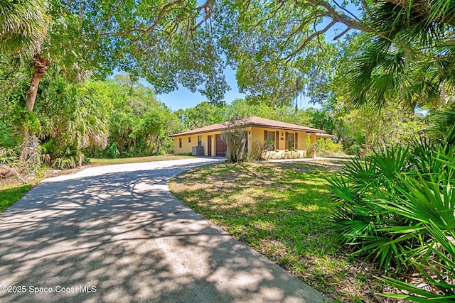 1812 Live Oak Dr N, Rockledge, FL 32955 - view of front of home with stucco siding and concrete driveway