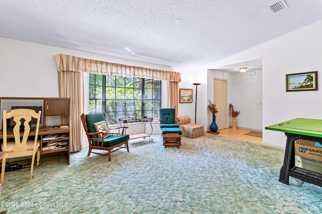 1812 Live Oak Dr N, Rockledge, FL 32955 - living area featuring carpet flooring, a textured ceiling, and visible vents