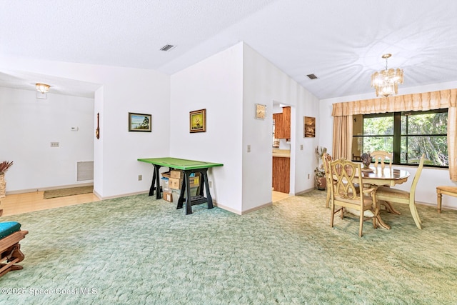 1812 Live Oak Dr N, Rockledge, FL 32955 - dining room with baseboards, a notable chandelier, carpet flooring, and lofted ceiling