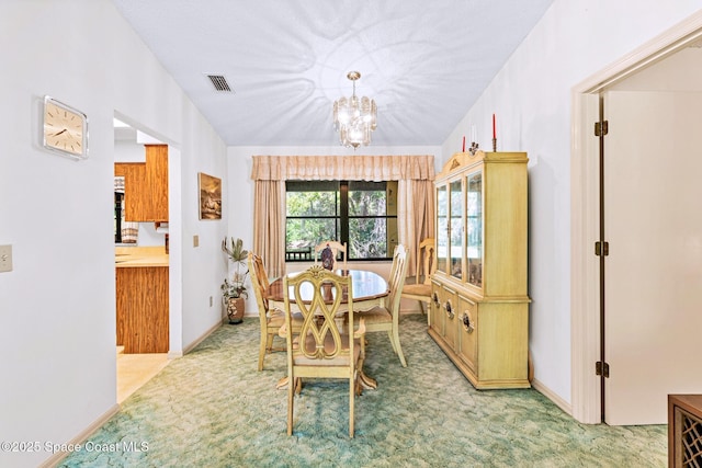 1812 Live Oak Dr N, Rockledge, FL 32955 - dining area with visible vents, carpet floors, and a notable chandelier