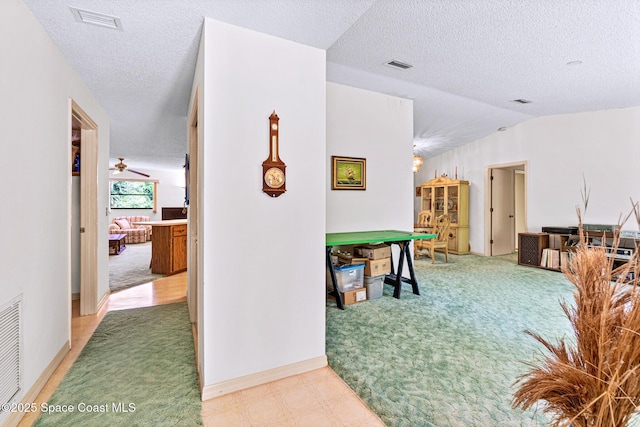 1812 Live Oak Dr N, Rockledge, FL 32955 - corridor with visible vents, a textured ceiling, and light colored carpet