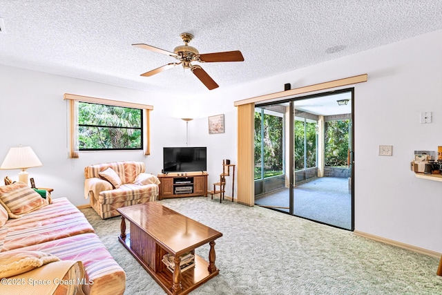 1812 Live Oak Dr N, Rockledge, FL 32955 - living area with a textured ceiling, plenty of natural light, light carpet, and ceiling fan