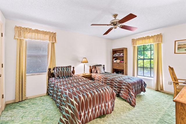 1812 Live Oak Dr N, Rockledge, FL 32955 - bedroom featuring baseboards, carpet flooring, a textured ceiling, and ceiling fan