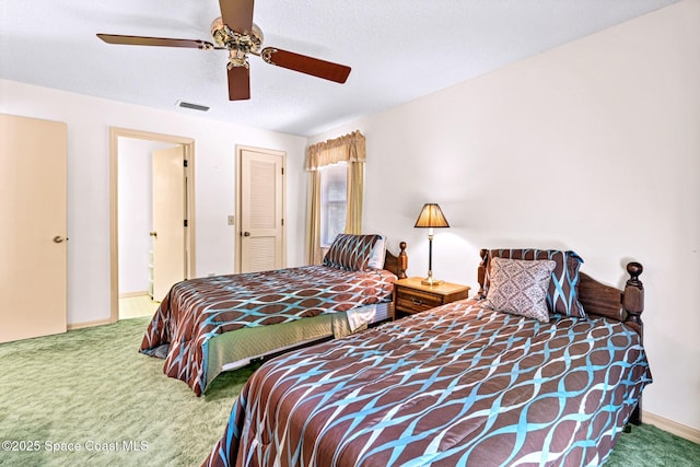 1812 Live Oak Dr N, Rockledge, FL 32955 - carpeted bedroom with a ceiling fan, baseboards, and visible vents