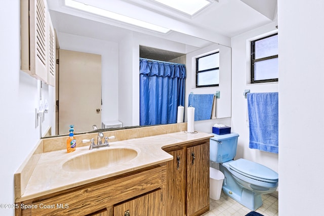 1812 Live Oak Dr N, Rockledge, FL 32955 - full bath with vanity, a shower with curtain, and toilet