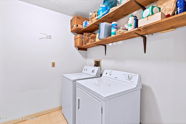 1812 Live Oak Dr N, Rockledge, FL 32955 - washroom with baseboards, laundry area, a textured ceiling, and washing machine and clothes dryer