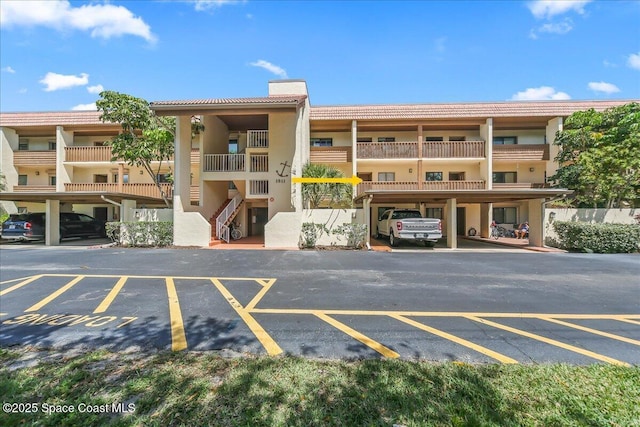 view of property with covered parking