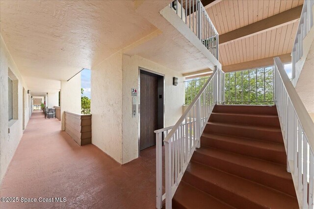 staircase featuring elevator