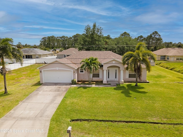 466 Olney St, Palm Bay, FL 32908 - view of front of home featuring fence, a front lawn, stucco siding, concrete driveway, and a garage