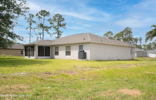 466 Olney St, Palm Bay, FL 32908 - rear view of property featuring a yard, central air condition unit, and a sunroom