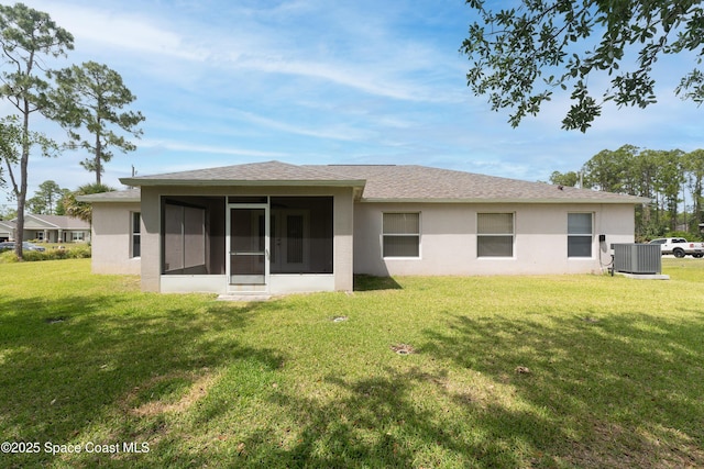 466 Olney St, Palm Bay, FL 32908 - rear view of house featuring stucco siding, central AC unit, a sunroom, and a lawn