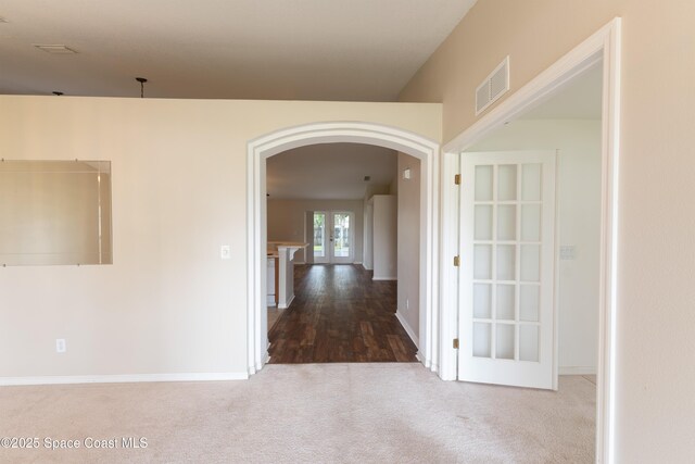 466 Olney St, Palm Bay, FL 32908 - hall featuring carpet, baseboards, visible vents, and arched walkways