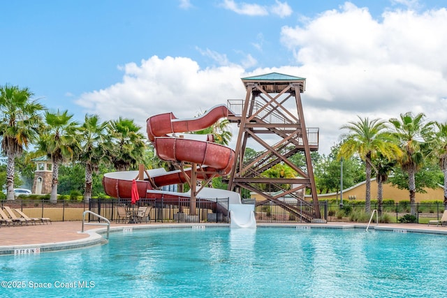 4484 Caladium Cir, West Melbourne, FL 32904 - community pool with a water slide and fence