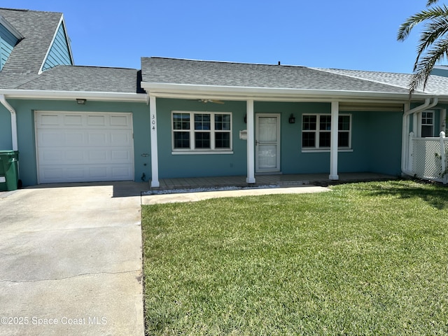 304 Emerald Pl E, Indian Harbour Beach, FL 32937 - ranch-style home featuring roof with shingles, an attached garage, driveway, and a porch