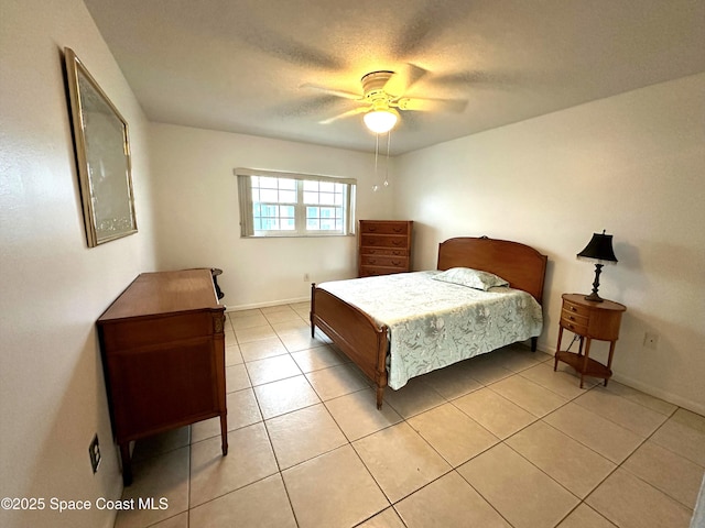 304 Emerald Pl E, Indian Harbour Beach, FL 32937 - bedroom featuring light tile patterned floors and ceiling fan