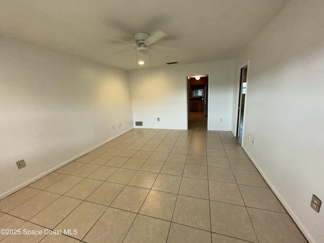 304 Emerald Pl E, Indian Harbour Beach, FL 32937 - spare room featuring a ceiling fan and light tile patterned floors