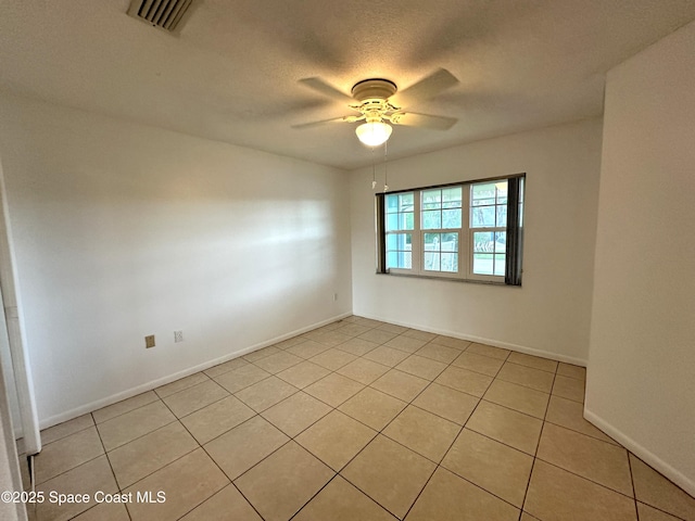 304 Emerald Pl E, Indian Harbour Beach, FL 32937 - empty room with a ceiling fan and light tile patterned floors