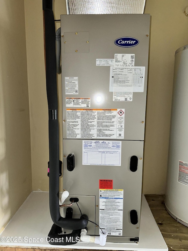 304 Emerald Pl E, Indian Harbour Beach, FL 32937 - utilities featuring water heater and heating unit