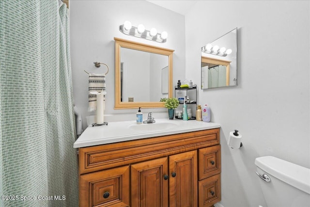 full bathroom with vanity and toilet