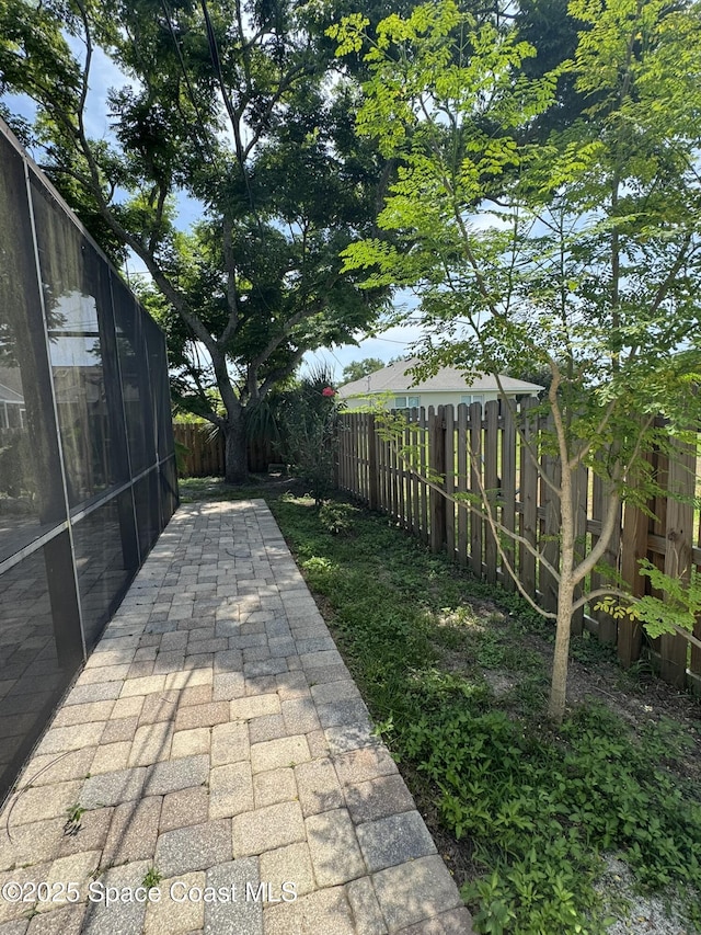 fenced backyard featuring a patio