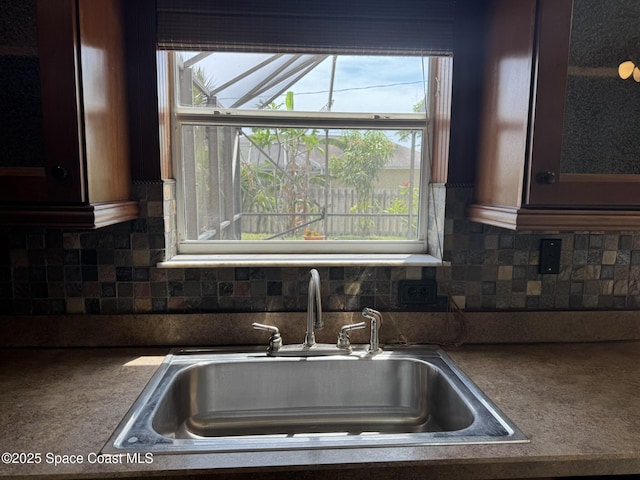 kitchen featuring a sink and backsplash
