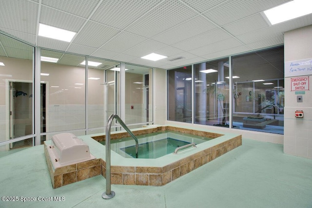 view of pool with an indoor in ground hot tub